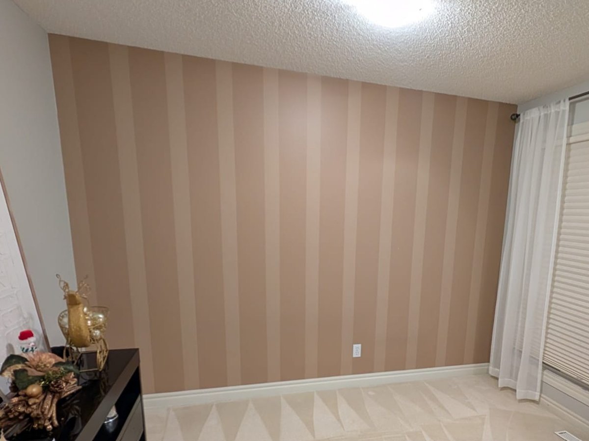Bedroom striped accent wall repaint by Royal Surface Painting, Calgary
