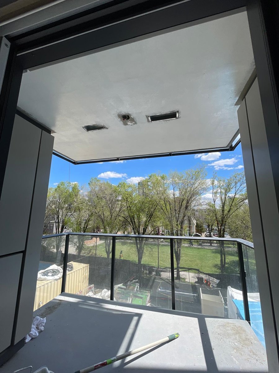 Repainted balcony with city view by Royal Surface Painting, Calgary