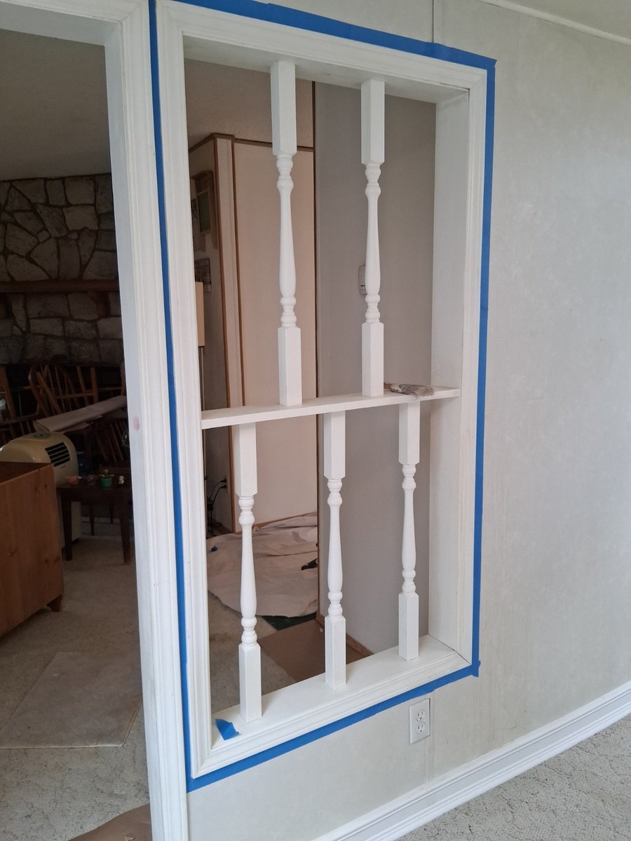 Careful masking around a spindled opening by Royal Surface Painting, Calgary