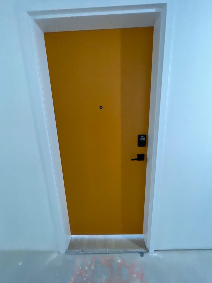 Lemon yellow entry door by Royal Surface Painting, Calgary